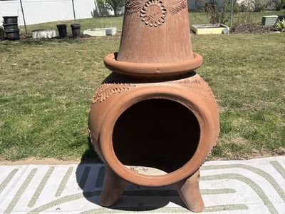 Mexican-style terracotta chiminea (outdoor fireplace)
