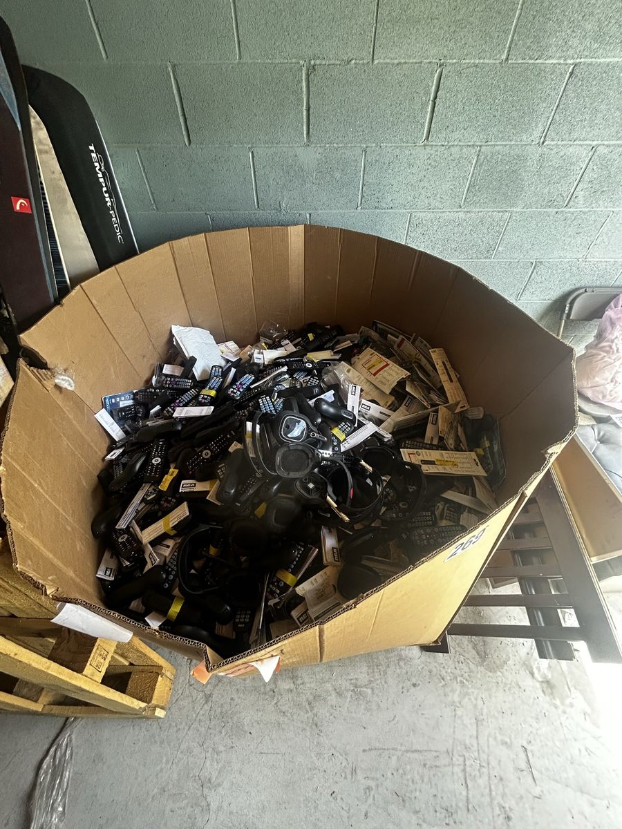 Storage unit clearance sale pallet of remotes