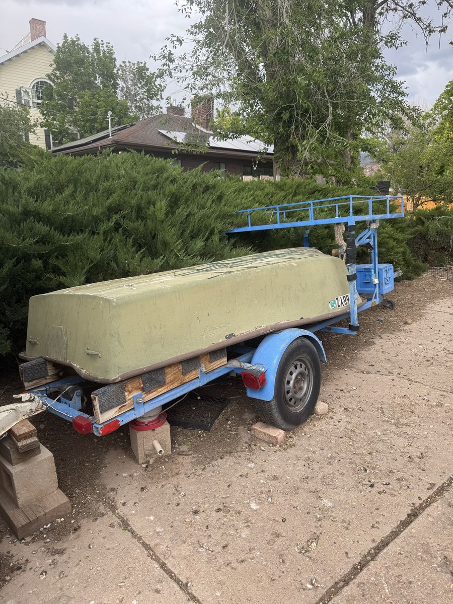 Small vintage fiberglass  Jon Boat / Dinghy with Custom Single-Axle Trailer, Storage Box, and Upper Rack