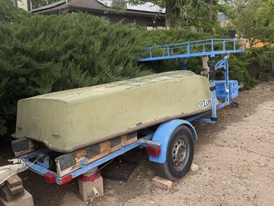 Small vintage fiberglass Jon Boat / Dinghy with Custom Single-Axle Trailer, Storage Box, and Upper Rack