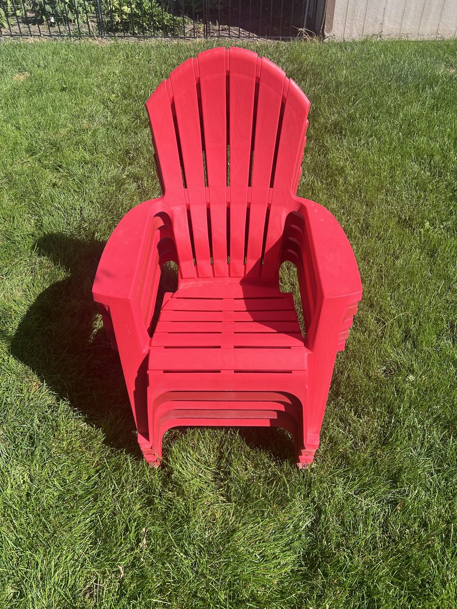 5 Red Plastic Adirondack Chairs