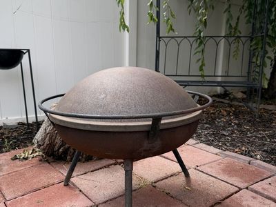 Outdoor Metal Fire Pit Bowl with Lid and firewood