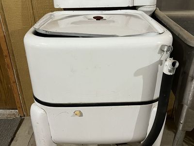Vintage Maytag Wringer Washer with white enamel finish.