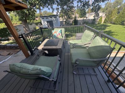 Patio Conversation Set with Fire Table and Green Cushions