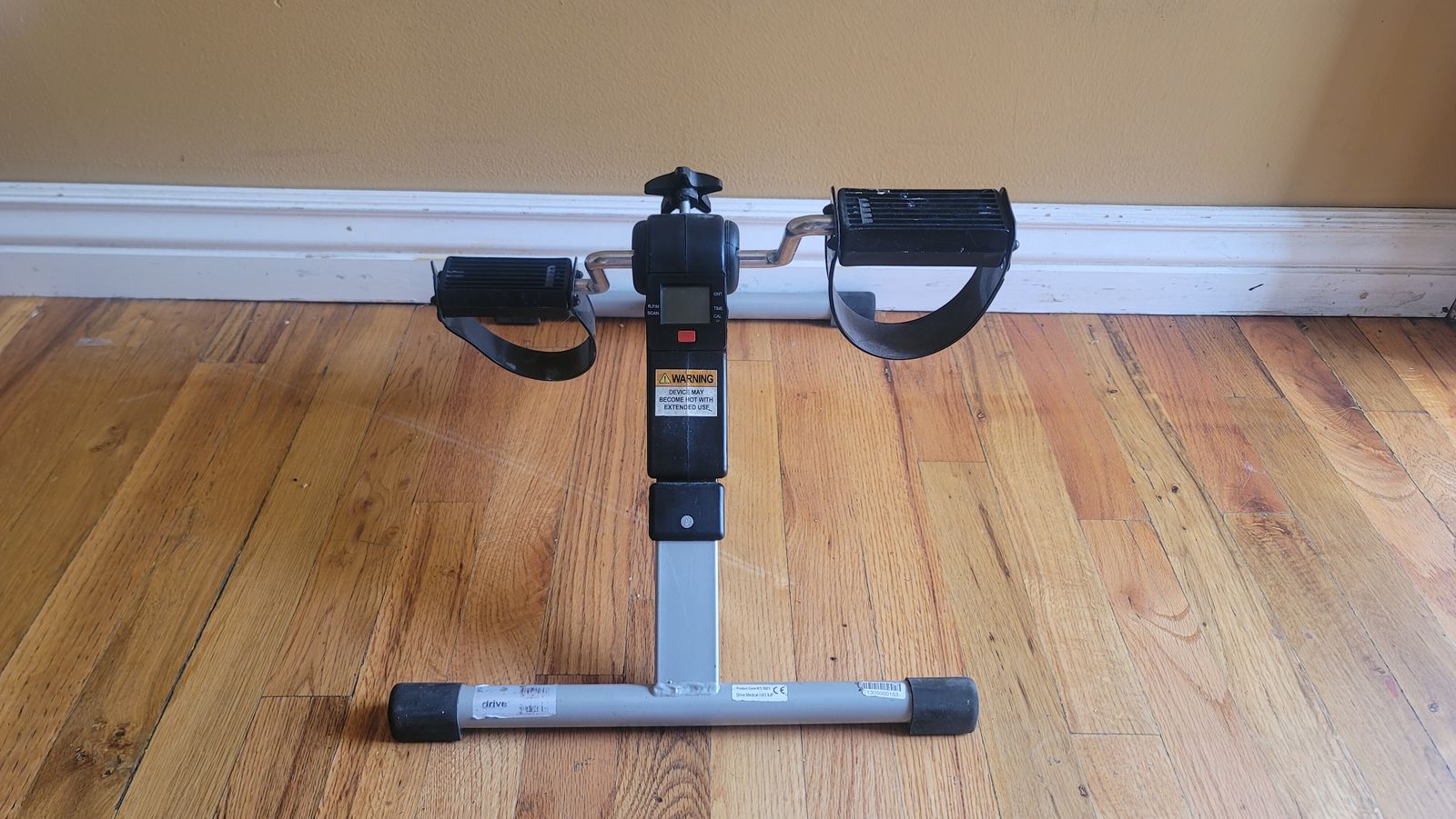Folding pedal exercise machine