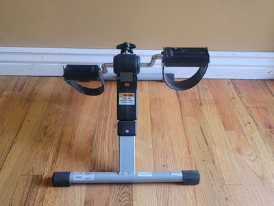 Folding pedal exercise machine