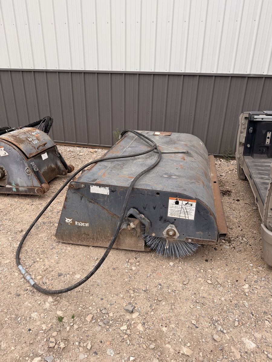 Sweeper skid steer attachment