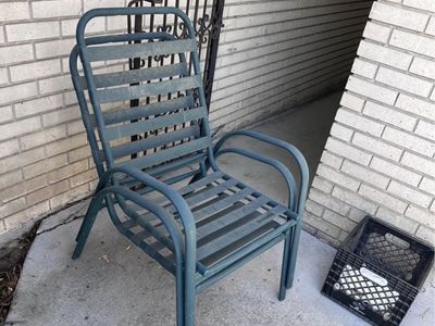 Green metal outdoor chair no cushions