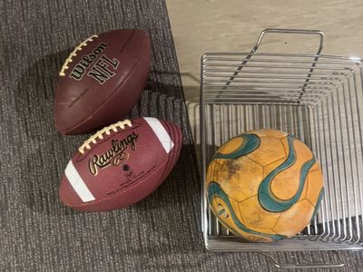 Lot of 3 Sports Balls: Wilson NFL Football, Rawlings Football, and Soccer Ball with Wire Basket