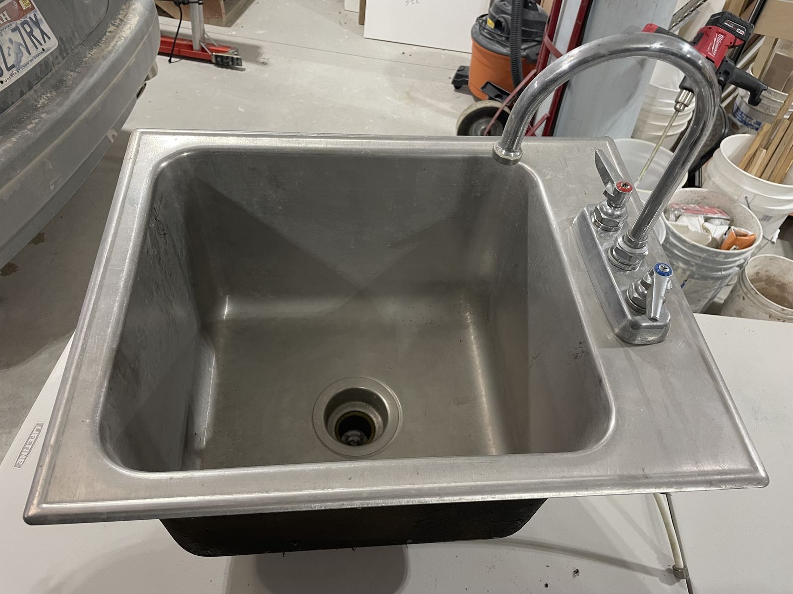 Stainless steel sink with faucet