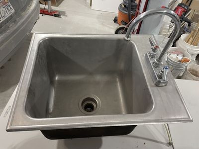 Stainless steel sink with faucet