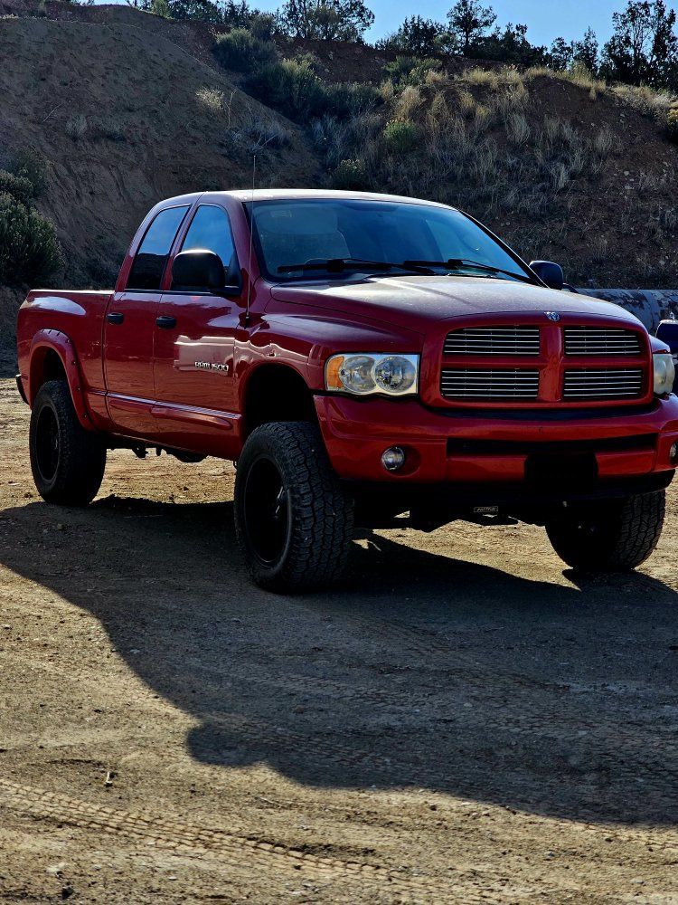 Dodge Ram 1500 Quad Cab 4x4 - Red Lifted Pickup Truck