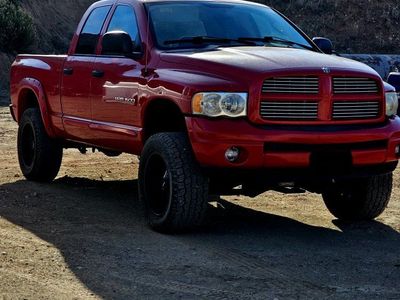 Dodge Ram 1500 Quad Cab 4x4 - Red Lifted Pickup Truck