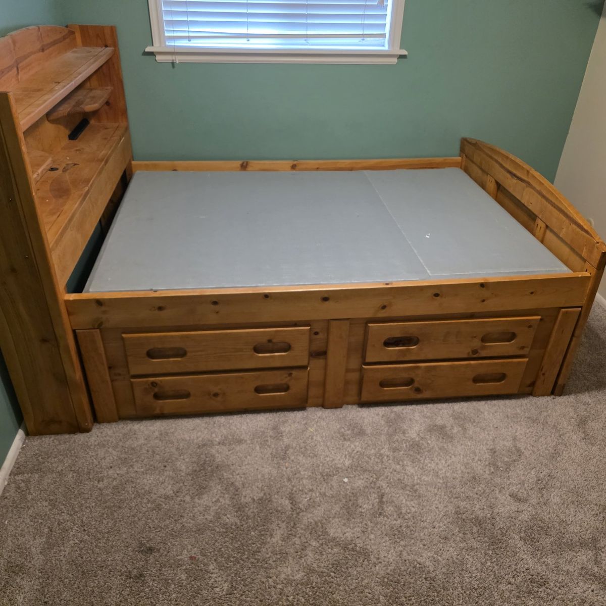 Size is a full. bedframe with drawers and headboard all wood.