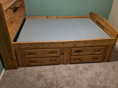 Size is a full. bedframe with drawers and headboard all wood.