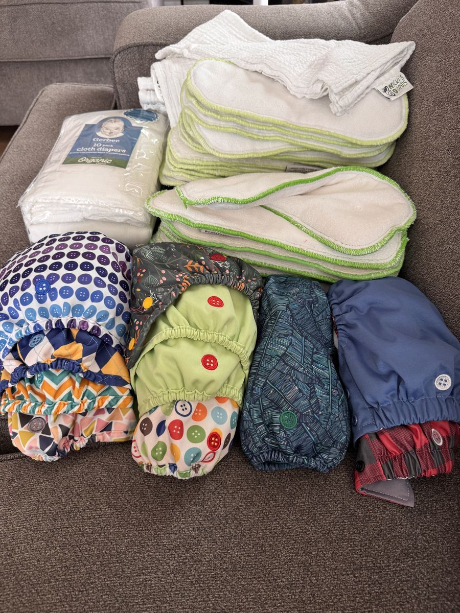 12 Buttons Cloth Diaper covers 9 all size 1 extra large and 2 trainers