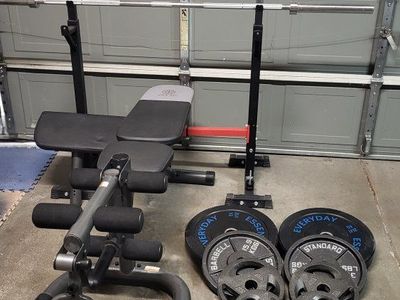 Bench and 260 pounds of weights