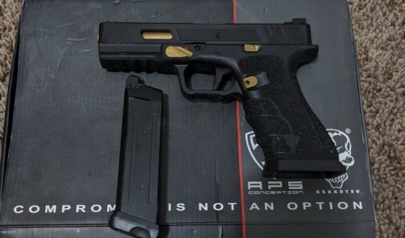 Custom gold and black Glock.