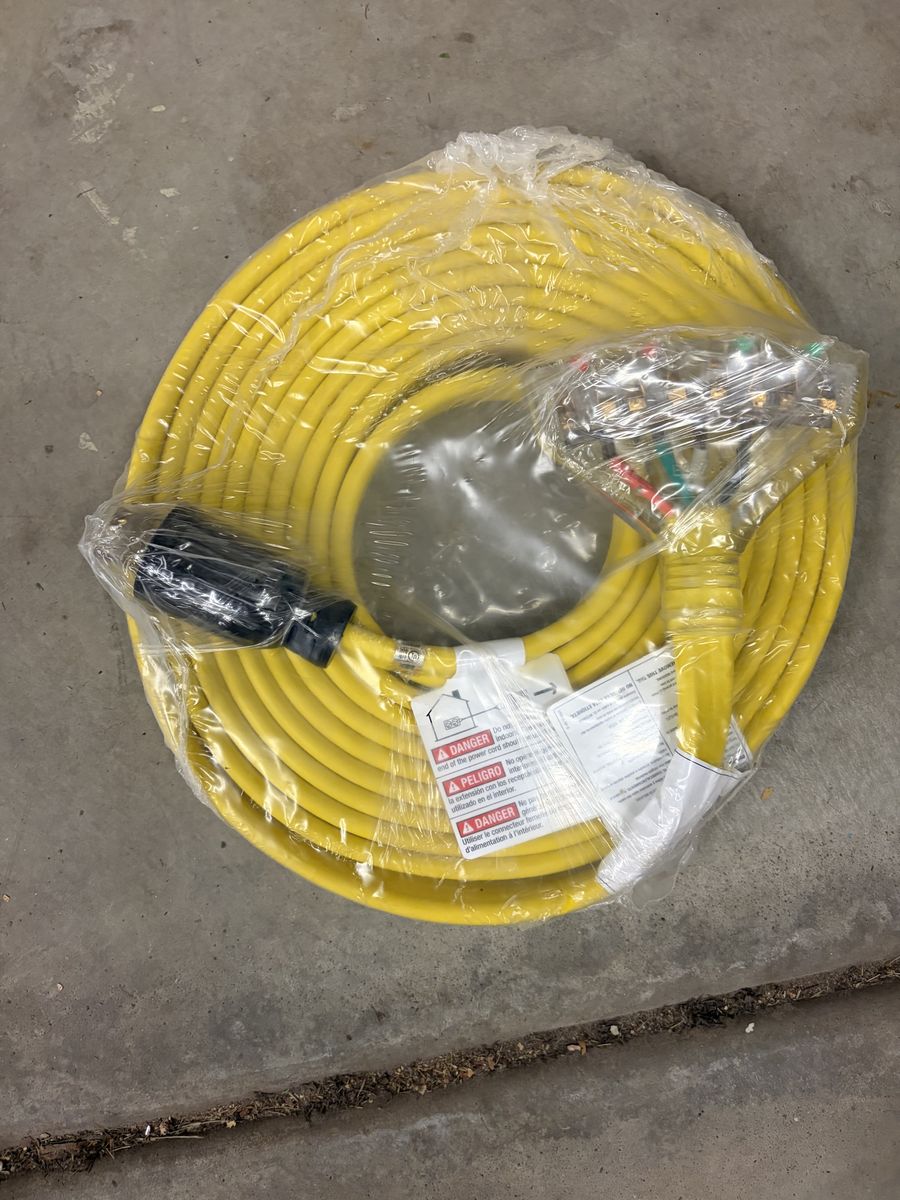 Either Nema L14-30 or 50R or 14-30 or 50R.  Heavy Duty Yellow Extension Cord with Multiple Outlets