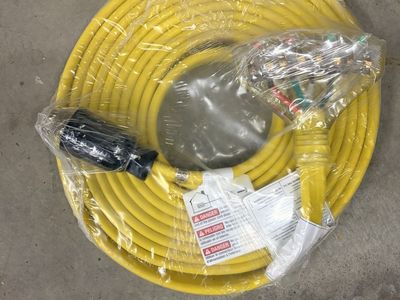 Either Nema L14-30 or 50R or 14-30 or 50R. Heavy Duty Yellow Extension Cord with Multiple Outlets