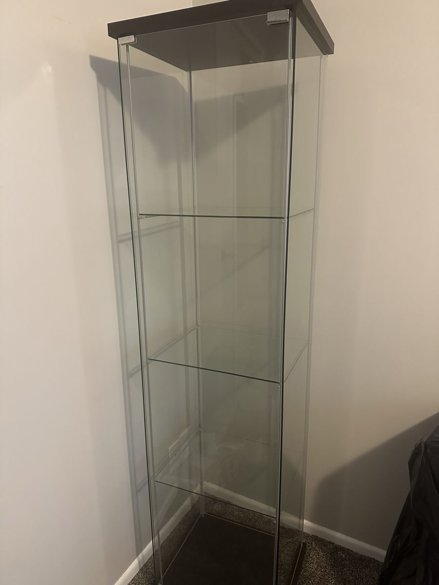Tall Glass Display Cabinet with Multiple Shelves and Dark Wood Base