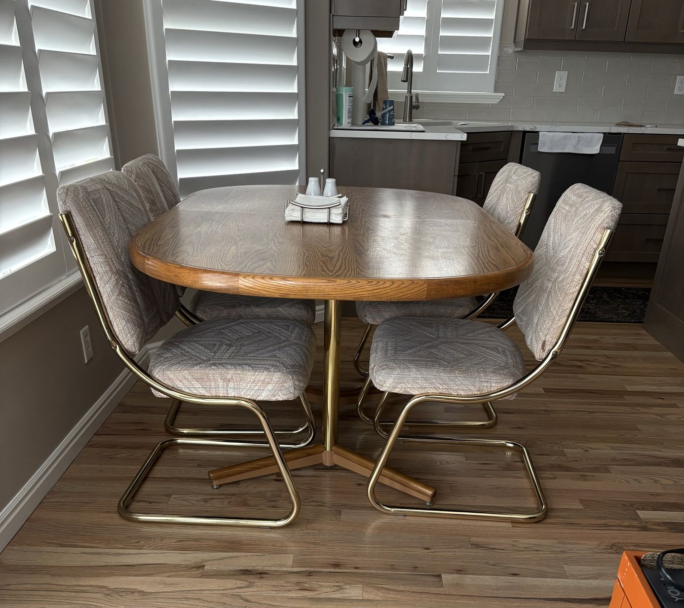 Chromcraft table 40 x 60-95 with 2 extension leaves, 7 upholstered and brass cantilever chairs.