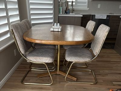 Chromcraft table 40 x 60-95 with 2 extension leaves, 7 upholstered and brass cantilever chairs.