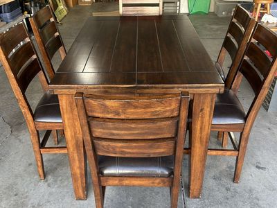 solid wood table with 6 leather chairs