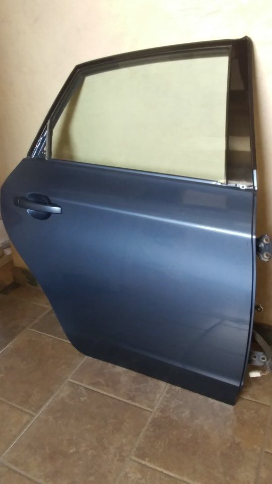 Subaru Door Impreza 2.5i sedan rear passenger complete with interior panel and window glass blue