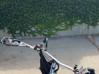 three-wheel golf push cart is a Top-Flite TF 360 model with a silver aluminum frame