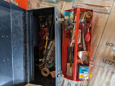 METAL TOOL BOX WITH TOOLS OF ALL KINDS.