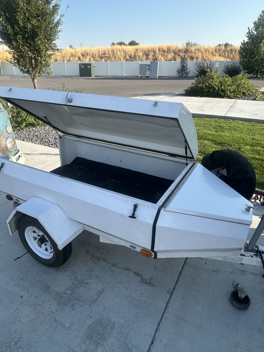 White Enclosed Utility Trailer with Hinged Lid and Tongue Storage Box