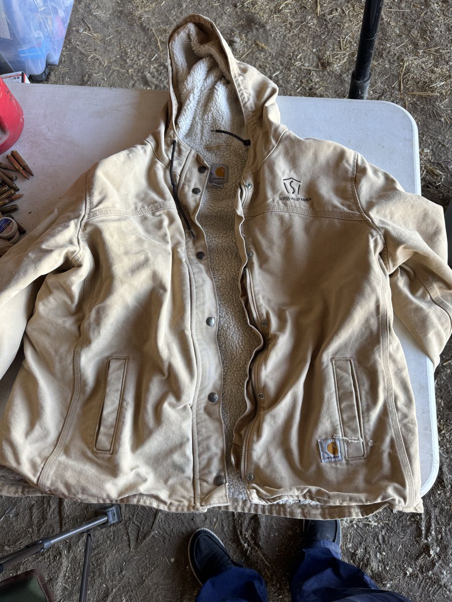 Carhartt woman coat and cabela’s hunting orange bibs underArmor sweatshirt 