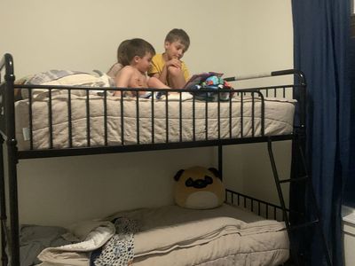 Metal Twin Bunk Bed with Ladder & 2 Mattresses - Great Condition, Powder Coated Black