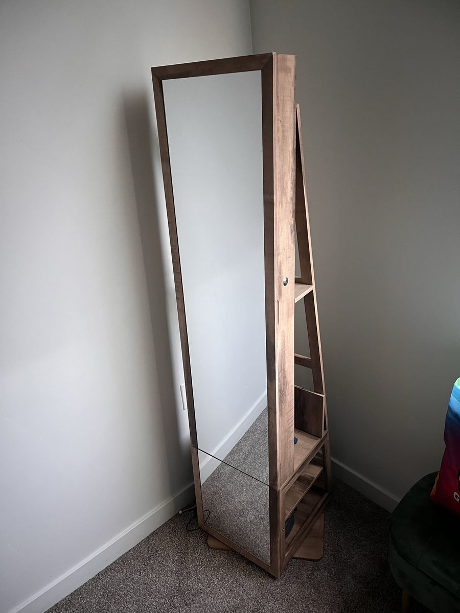 Standing mirror with jewelry storage and lights