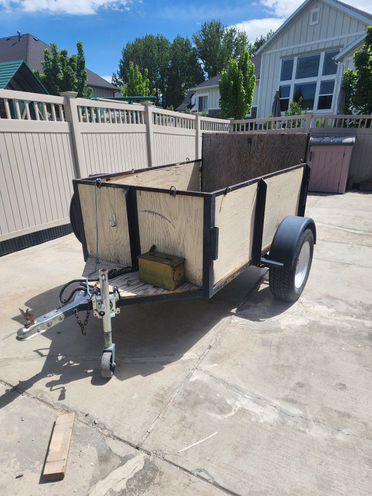 Utility Trailer with Folding Gate - Great for Hauling, Moving, and DIY Projects needs work has rust. Axel and tires are good.