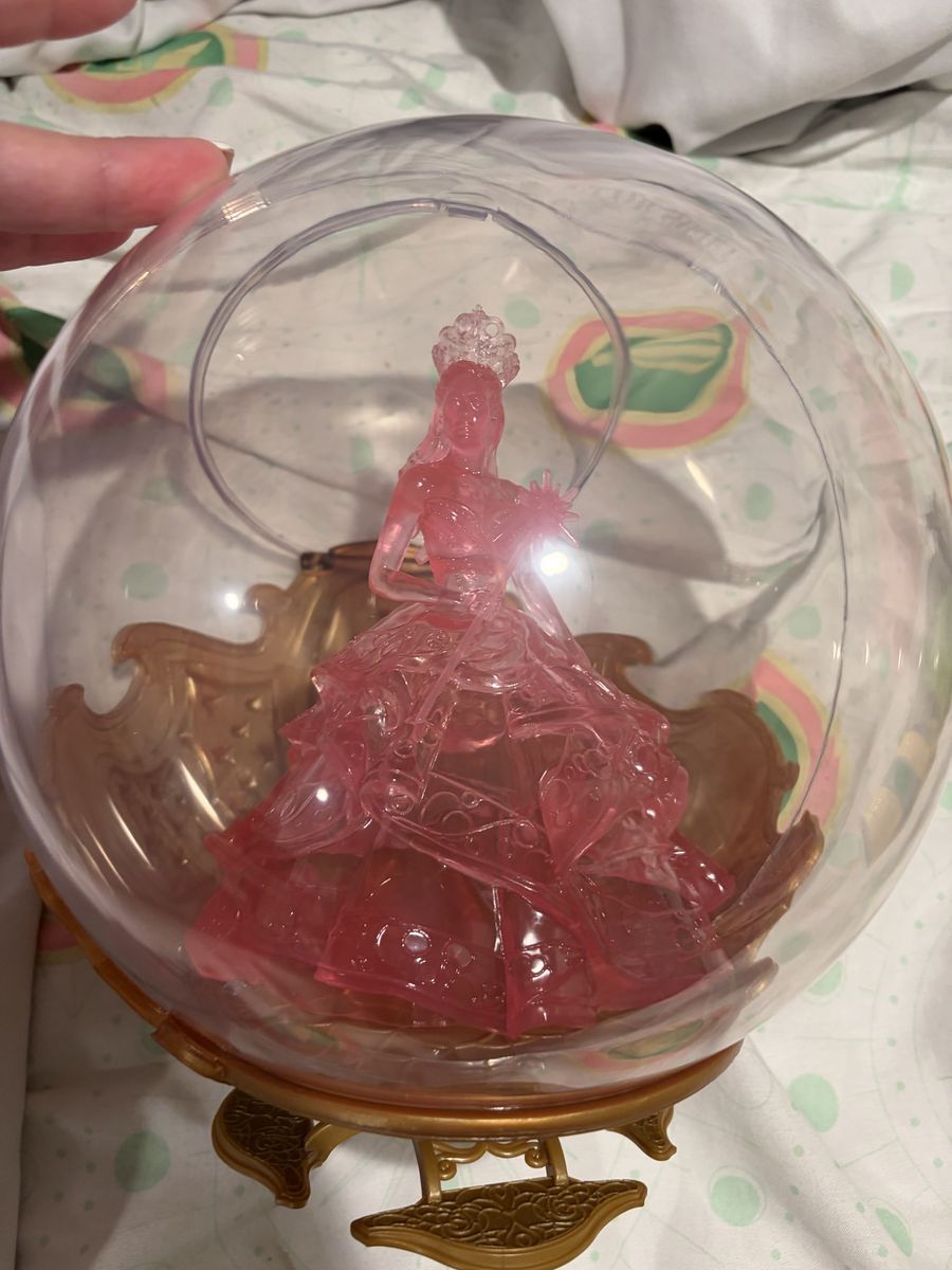 AMC theaters, wicked exclusive Glinda bubble popcorn bucket and the wicked witch of west cup topper