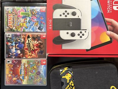 Nintendo Switch OLED Console Bundle w/ 3 Games & Pikachu Carrying Case