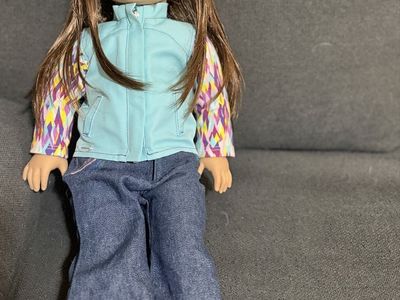 American Girl Doll with Brown Hair, Blue Vest, and Jeans
