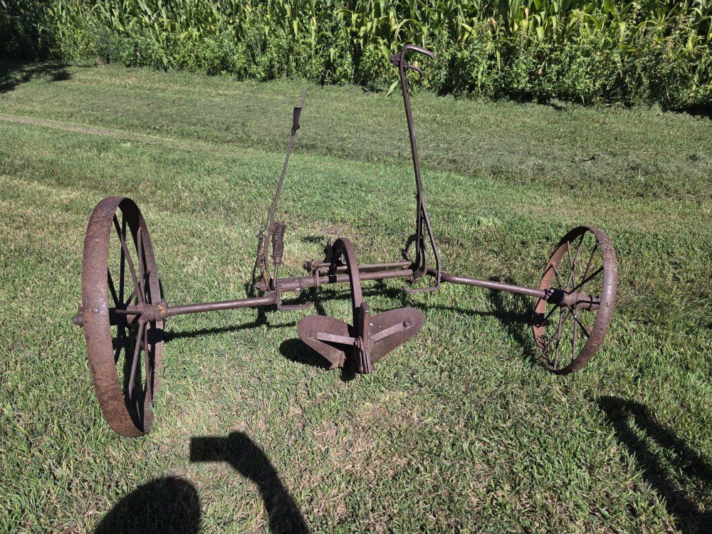 Horse drawn furrowing implement 