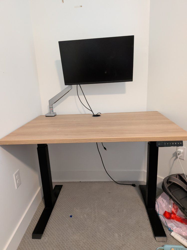 Adjustable Standing Desk with Wood Grain Top and Monitor Arm