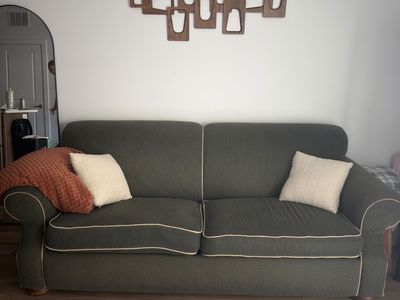 Green Fabric Couch/Sofa with Tan Piping - Used Good Condition