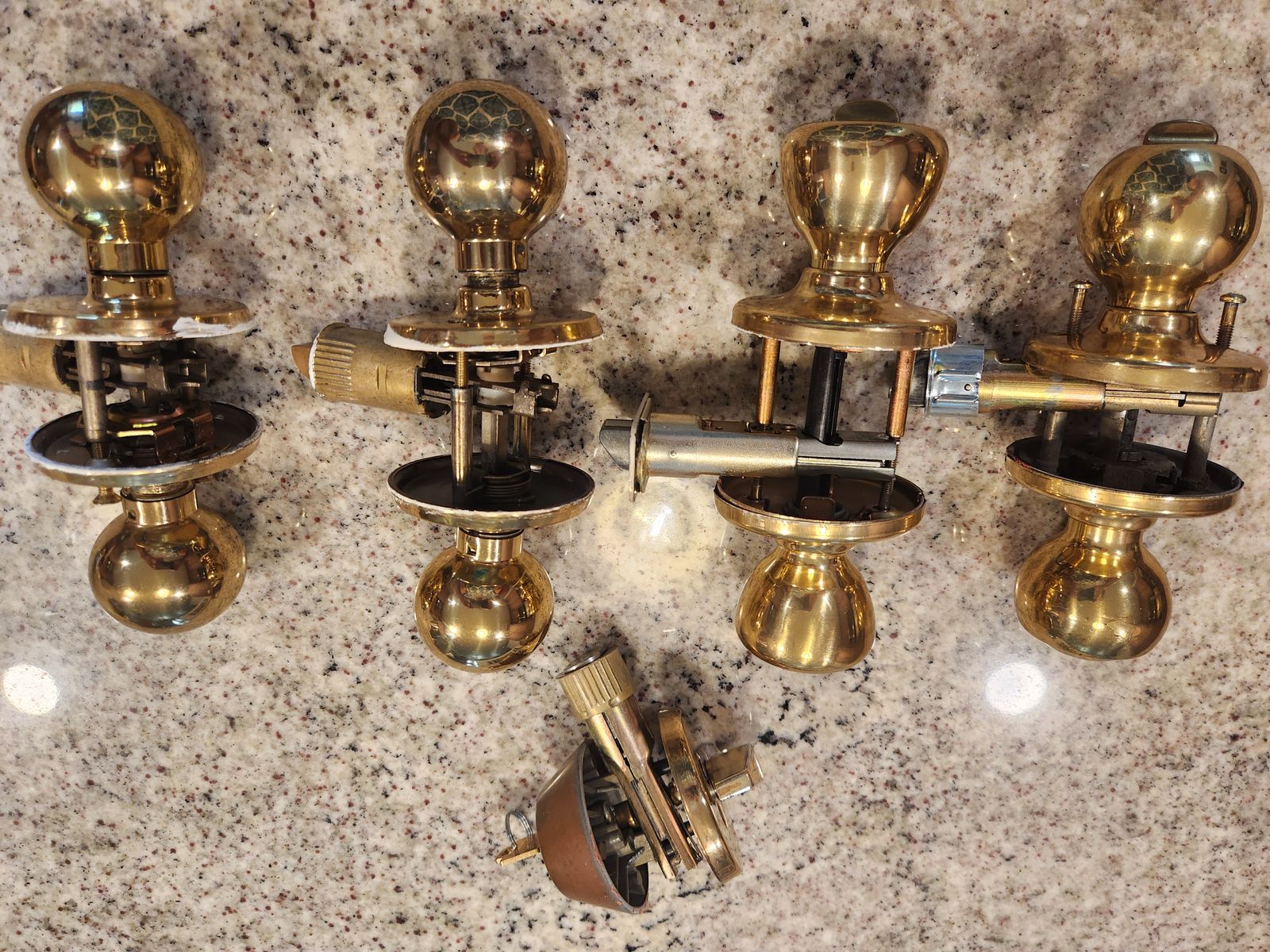 Four gold door knobs