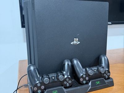 Sony PlayStation PS4 Pro 2.0 TB Bundle with 2 Controllers,Cooling Fan Dock, Steel series Headset.