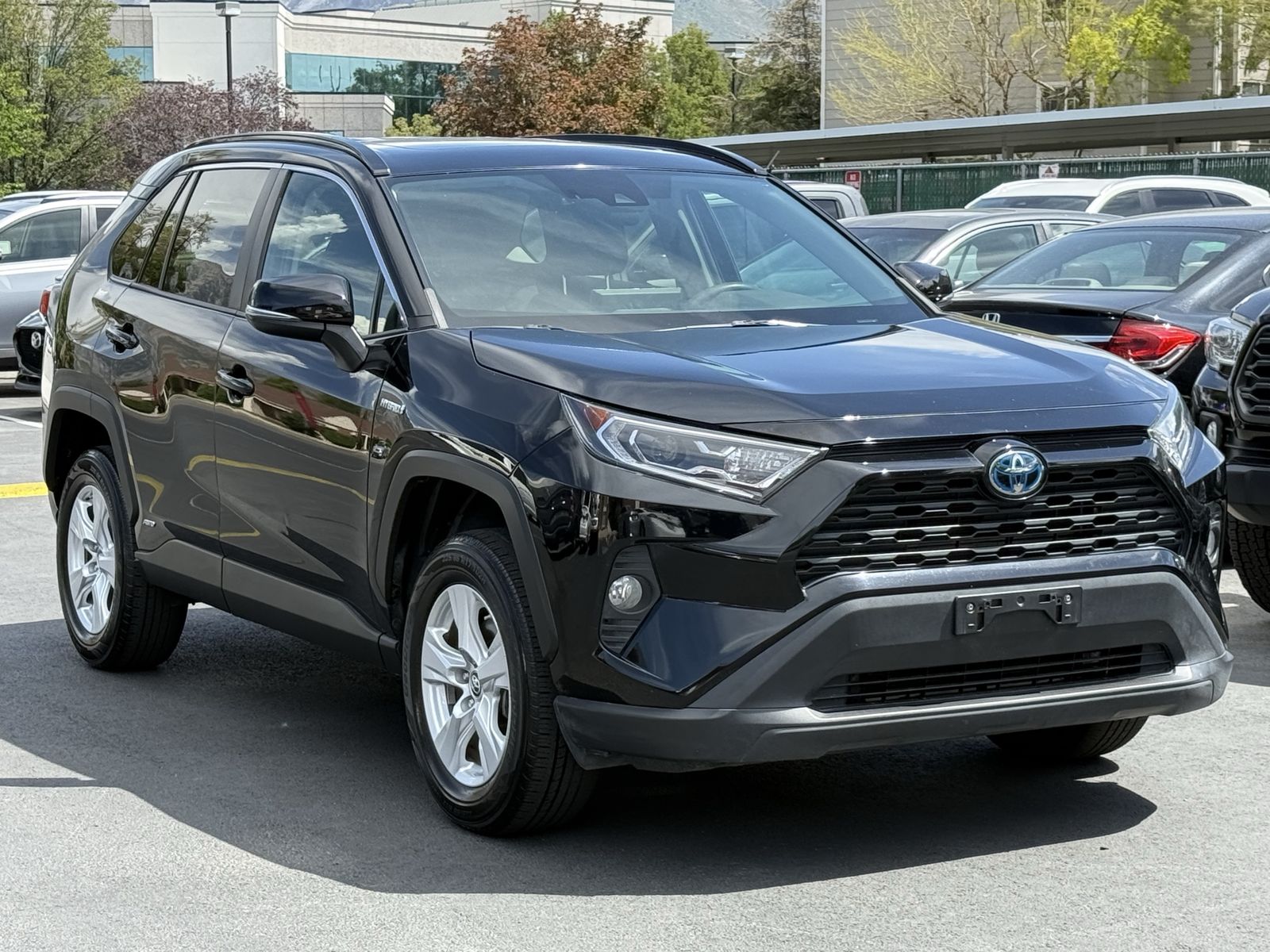 2019 Toyota RAV4 XLE — rebuilt & branded title, 9% below market