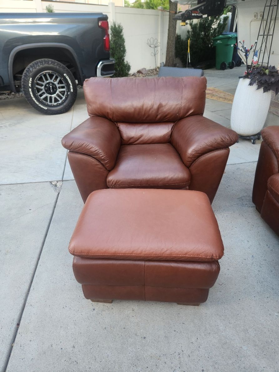 Leather couch, chairs, and ottomans