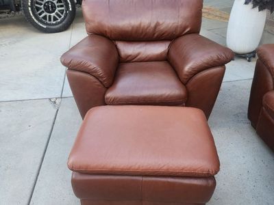 Leather couch, chairs, and ottomans