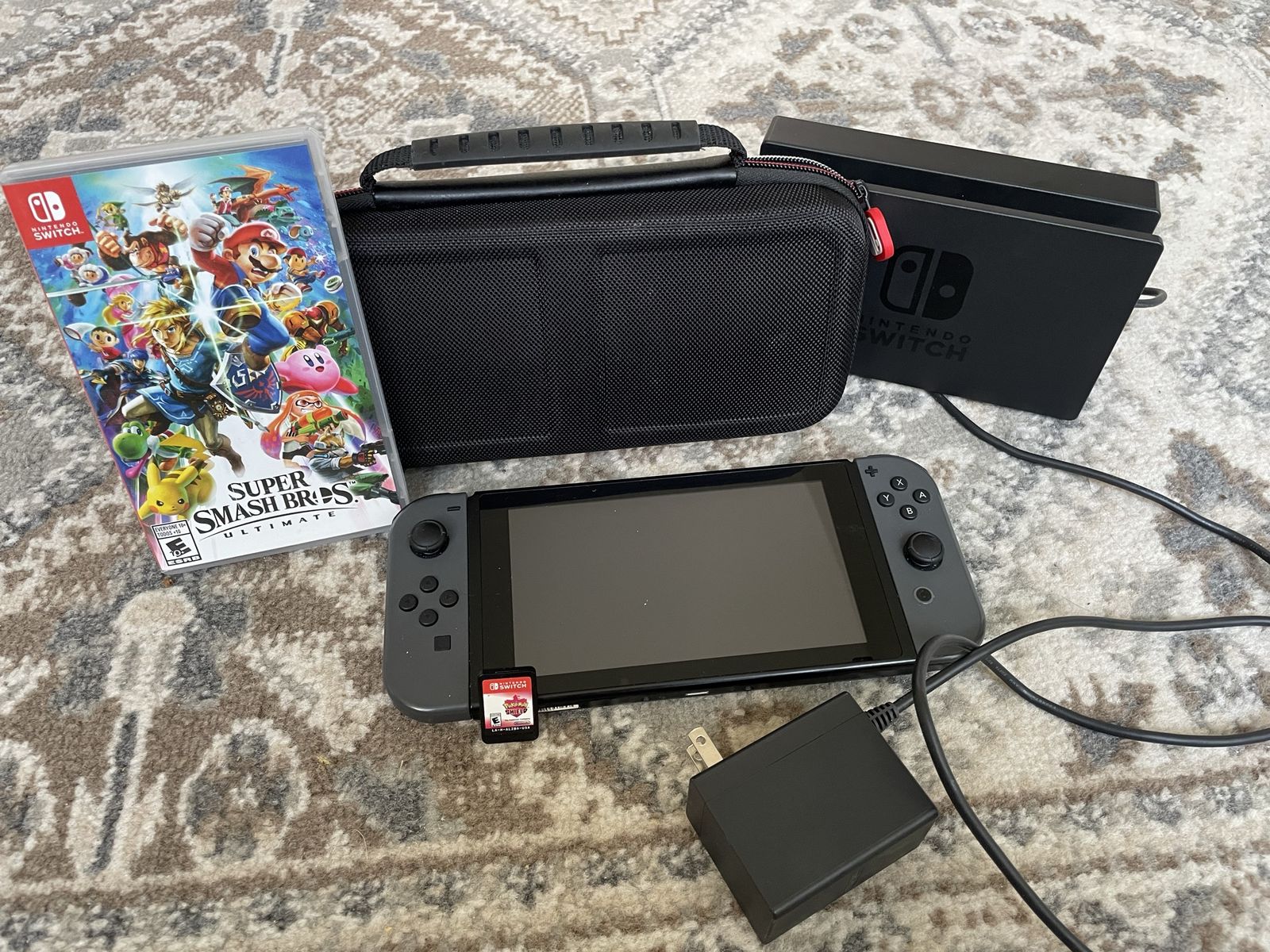 Nintendo switch game console,  super smash bros ultimate and Pokémon shield bundle