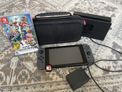 Nintendo switch game console, super smash bros ultimate and Pokémon shield bundle