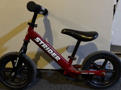 Strider Bike for small children - Red Launchpad Footrest Kids Balance Bike - Used, Good Condition
